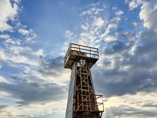 Tsunami Warning Tower with cloudy sky background