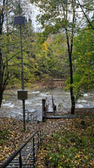 A small mountain river with a flow of water in the Polish mountains. Eastern Sudetes