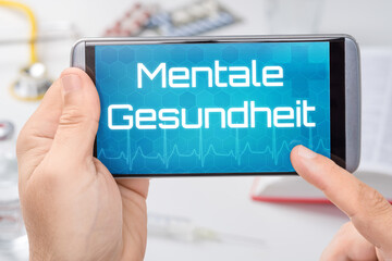 Smartphone mit dem Text Mentale Gesundheit
