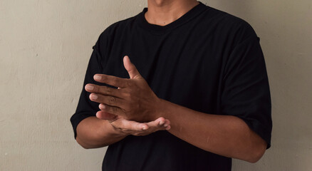 Young man make gesture hand about help sign language to meeting © syahrir