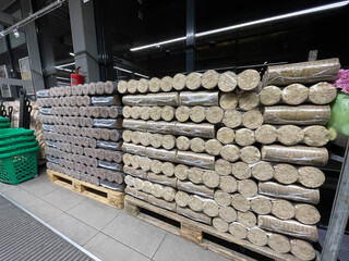 Wood briquettes for heating, packed in plastic film