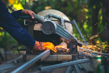 Welding machinery iron metal sparking fire flame close up construction Worker hands. Men hands protect glove Hot flame metal work cutting fire iron workshop. Locksmith Welding machine metal industry