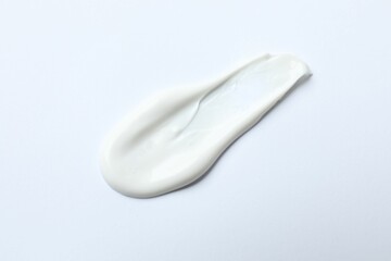 Smears of cream on a white background