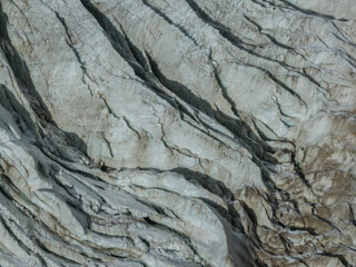 Fototapeta premium Aerial view of beautiful hanging glacier in high altitude mountains landscape