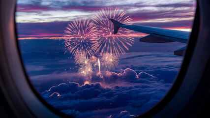 A vibrant display of fireworks in the evening sky view from an airplane window