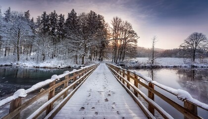 Frozen Path: A Wooden Bridge Beneath a Snowy Sky in Stare Juchy