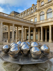 Palais-Royal in Paris, France. Courtyard of Honor. Former French royal palace on Rue Saint-Honoré, 1st arrondissement, now government offices, a public park and shopping arcade.