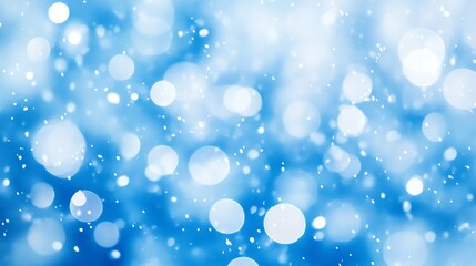 Abstract blue background with bokeh lights and white sparkles.
