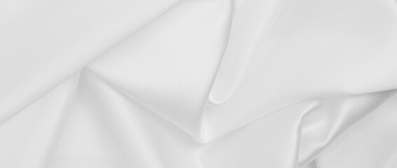 Smooth elegant white silk or satin luxury cloth texture as wedding background. Luxurious background design