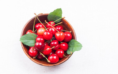 Fresh ripe cherries on wooden background