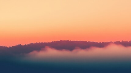 Fototapeta premium Serene landscape at dawn with mist and soft pastel colors.