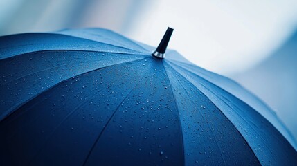 A branded umbrella with a sleek, modern design, featuring the company logo on the canopy.