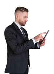 A businessman in aformal suit holding and using a tablet, isolated on a white background. Concept of professional technology usage