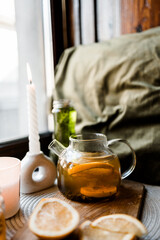 jar of honey, honey spoon, tea in a glass teapot, lemon, autumn mood, tea for colds