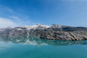 Obraz premium Prins Christian Sund Greenland mountain fjord with floating ice and shore iceberg on a summer day