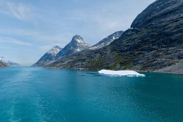Obraz premium Prins Christian Sund Greenland mountain fjord with floating ice and shore iceberg on a summer day