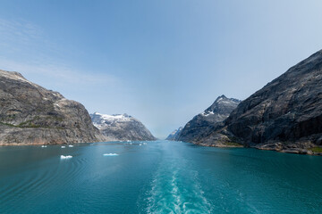 Prins Christian Sund Greenland mountain fjord with floating ice and shore iceberg on a summer day