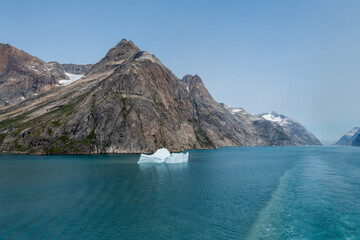 Prins Christian Sund Greenland mountain fjord with floating ice and shore iceberg on a summer day