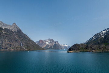 Prins Christian Sund Greenland mountain fjord with floating ice and shore iceberg on a summer day