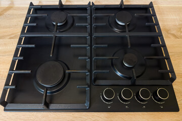 Empty gas cooktop with four burners built-in table top