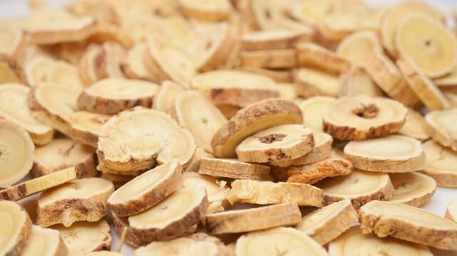 angle view herb BeiQi or Huang Qi or Radix Astragali or Astragalus Root rotating at horizontal