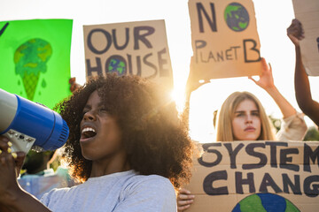 Young group of demonstrators on road from different culture and race protest for climate change -...
