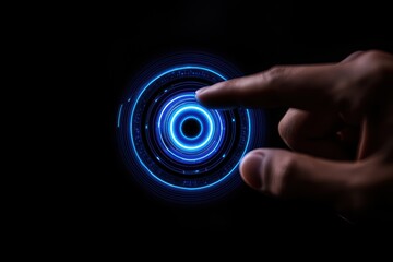 Fototapeta premium A glowing blue circular interface is touched by a finger against a dark background, suggesting interaction with technology or digital elements.
