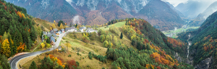Amazing autumn view with picturesque mountain village Strmec na Predelu in Julian Alps, Slovenia.