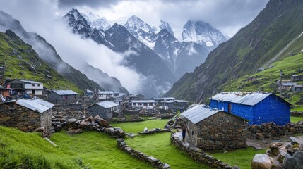 Here's a description for your stock photo.. Serene mountain village nestled in a valley, surrounded by lush greenery and towering snow-capped peaks.