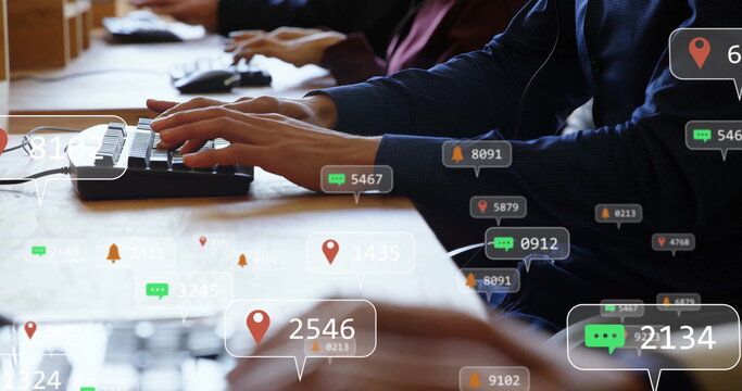 Image of social media icons with numbers over diverse colleagues typing on keyboards