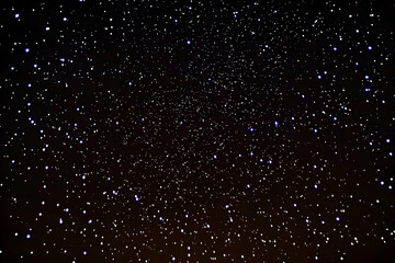 Obraz premium Stunning night sky image featuring a myriad of stars scattered across a deep black canvas. Ideal for backgrounds, websites, and design projects.