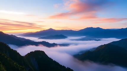 Majestic sunrise over misty mountain valley.