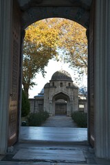Süleymaniye Mosque view through door with trees in fall