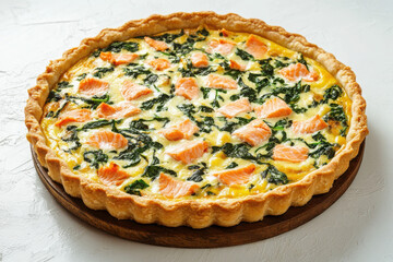 A savory salmon and spinach quiche in a golden crust, perfect for meals or gatherings.