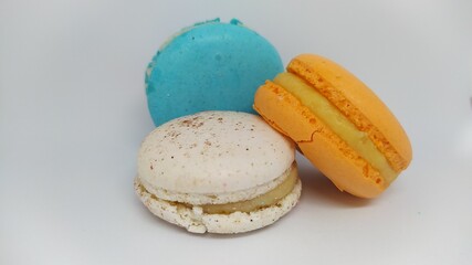 A Beautiful Array of Colorful Macarons Artfully Arranged on a Bright White Background