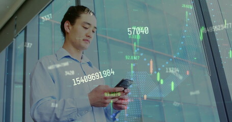 Image of financial data processing over asian businessman using smartphone