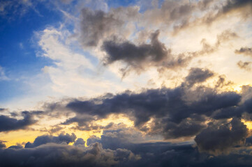 Fototapeta premium cloudy sky with clouds at sunset. Background of the orange blue sky at sunrise