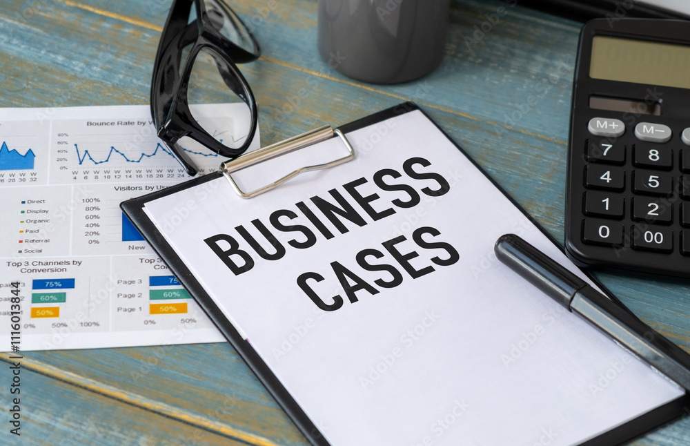 Aufkleber business cases text on notebook with chart and calculator