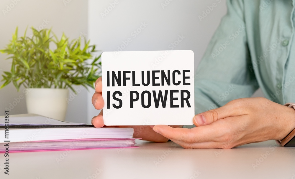 Poster influence is power text on a notepad on chart with keyboard and calculator on grey background