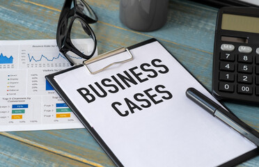 BUSINESS CASES text on notebook with chart and calculator