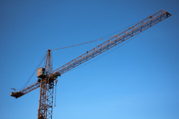 construction crane against blue sky