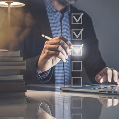 Businessman tick sign mark for assessment. Questionnaire, quality evaluation concept. Online survey