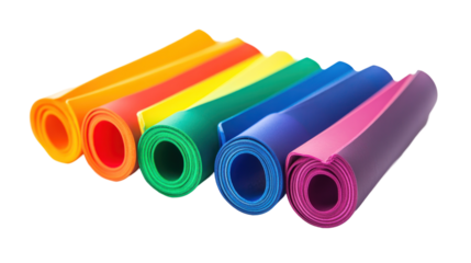 A collection of colorful exercise resistance bands rolled up, showcasing various vibrant colors for fitness activities.