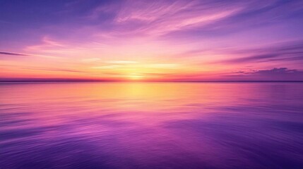 Obraz premium Serene sunset over calm waters with vibrant purple and orange hues.