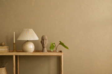 Natural-inspired decor with a stone lamp, minimalist sculpture, and soft green accents on a wooden...