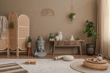 Spacious zen living area with earthy tones, natural decor, and a tranquil Buddha statue for a...