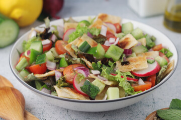 A bowl with Fattoush - Traditional Levantine salad