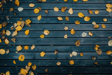 Naklejka premium Scattered Autumn Leaves on Wooden Surface
