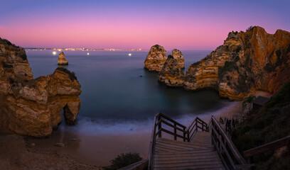View of rock formation at Camilo beach in Algarve, Portugal after sunset