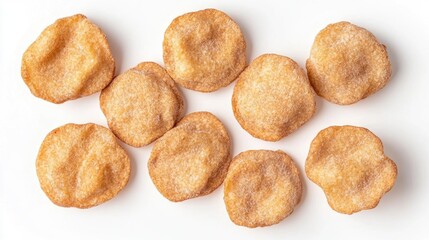 Naklejka premium Crispy round crackers arranged on a white background viewed from above showcasing their texture and golden color.